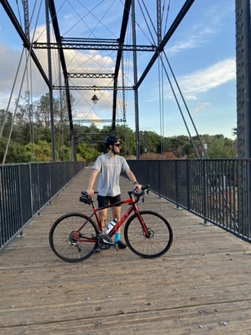 Cycling across an iron bridge